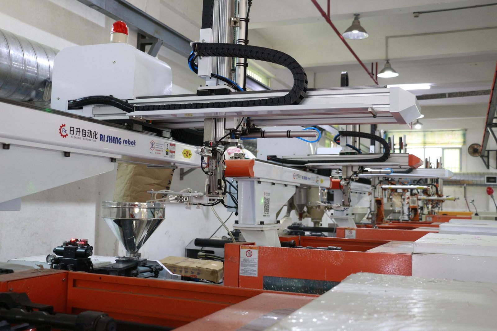 Workers operating TWS earphone production and packaging line
